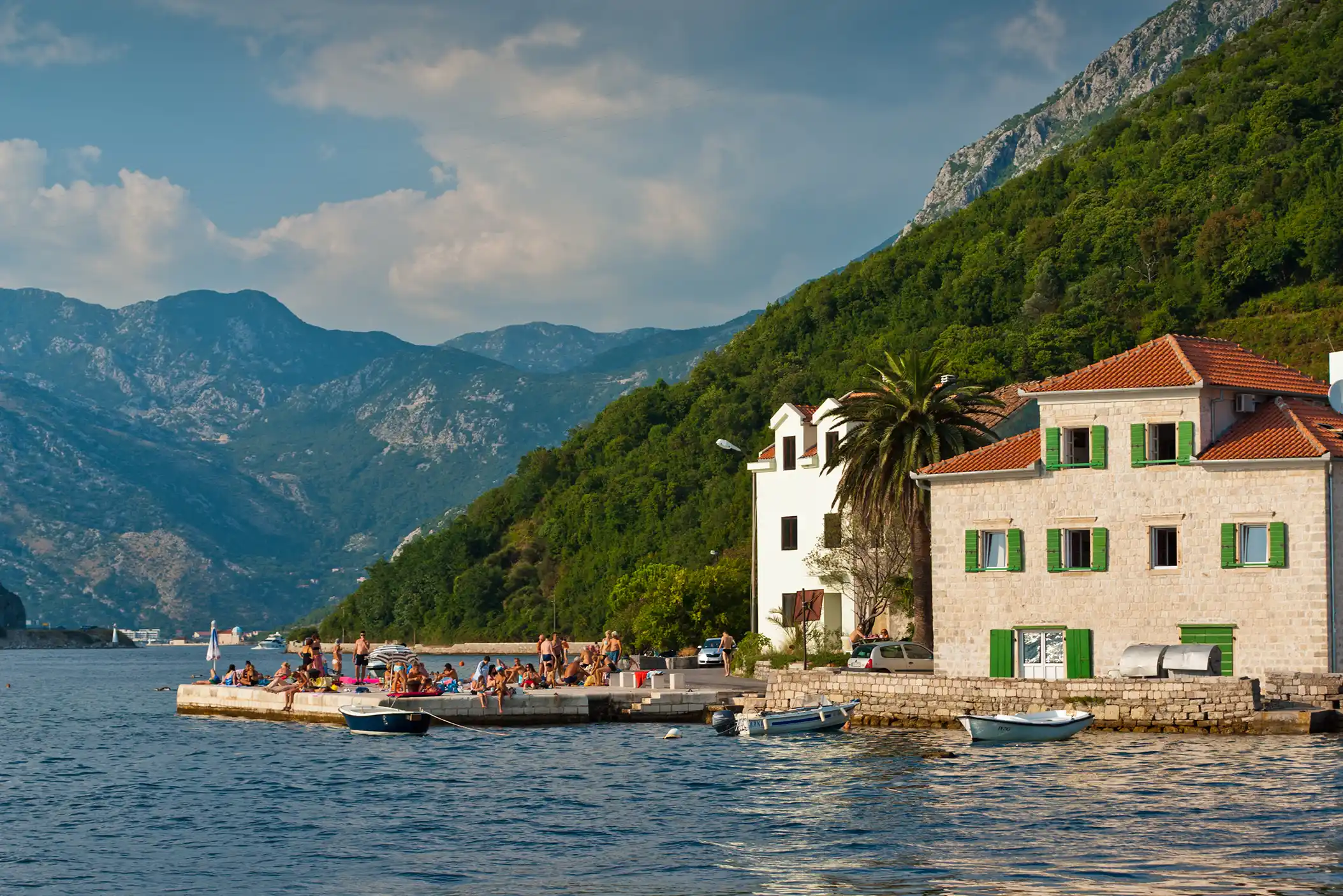 people sitting at dock in Tivat